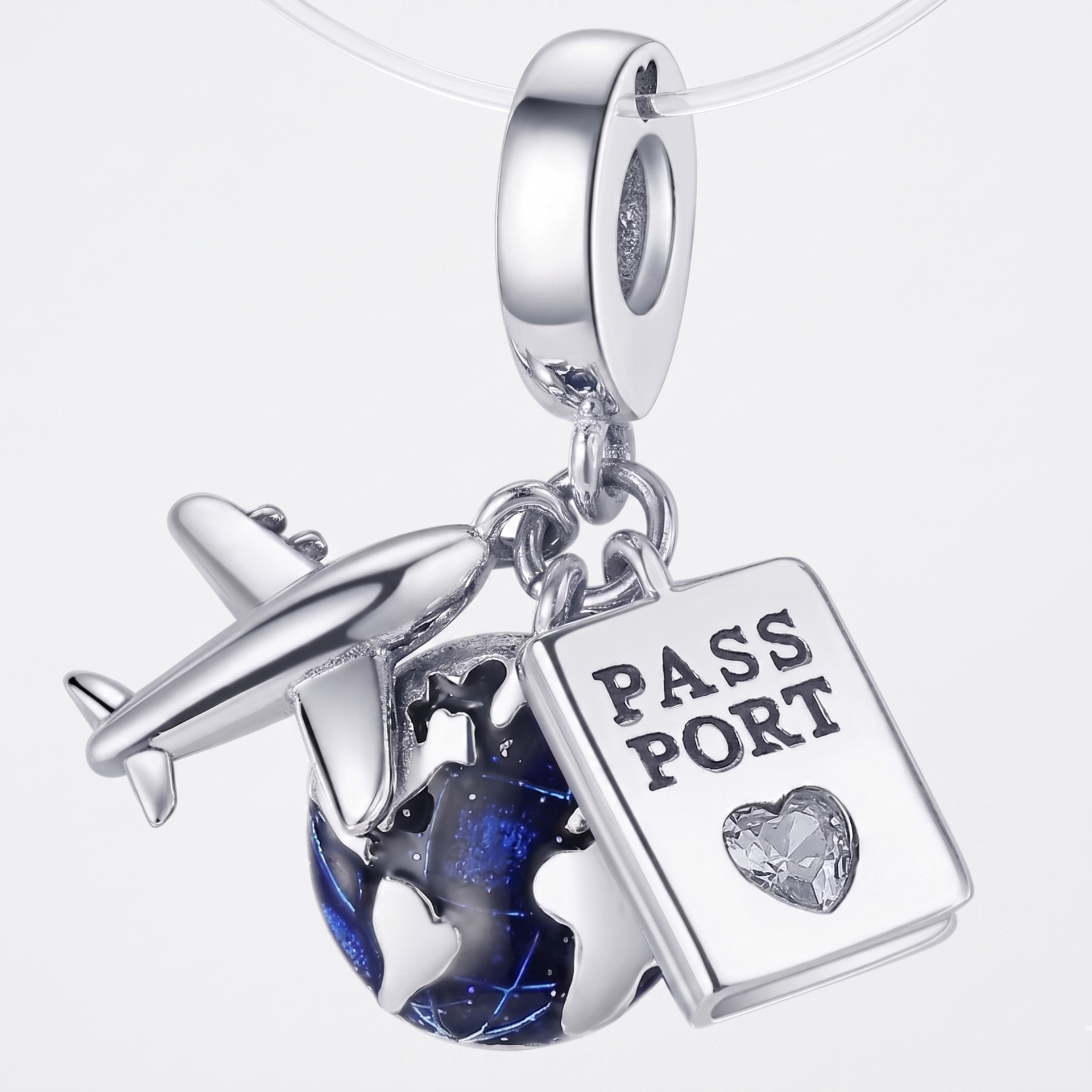 Charm Pasaporte, avión, mundo colgante